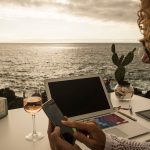 An image of a digital nomad's work station for an article about points hacking for digital nomad.