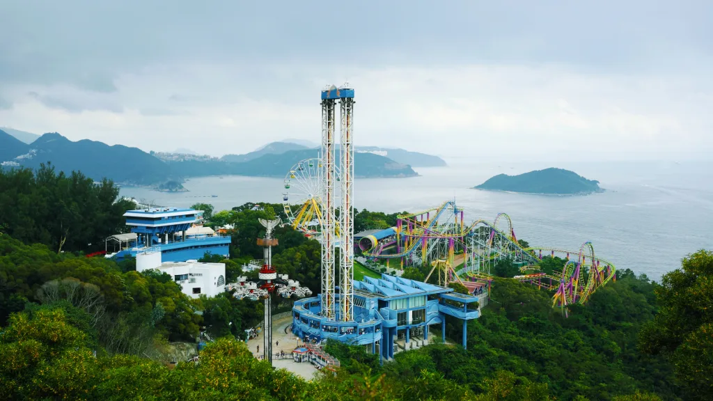 An image of an amusement park built close to a coast line.