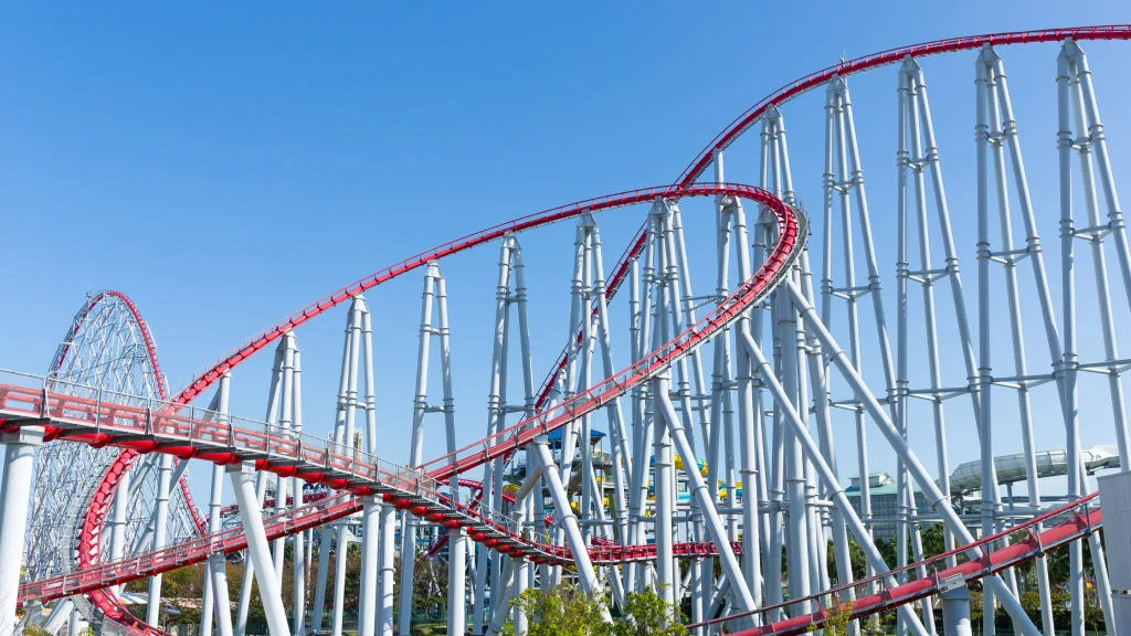 An image of a roller coaster rails in an amusement park.