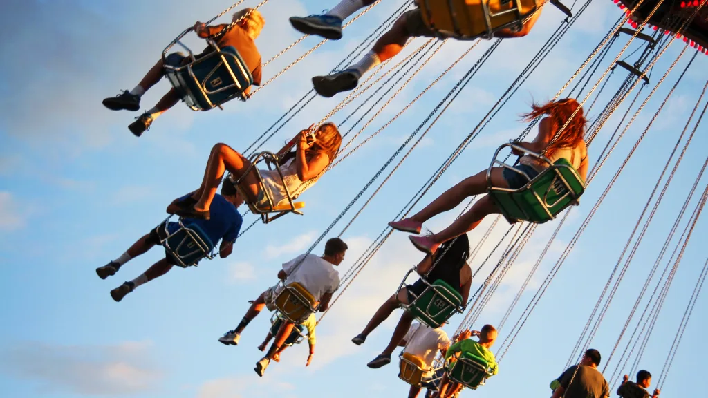 An image of tourists enjoying a thrill ride.