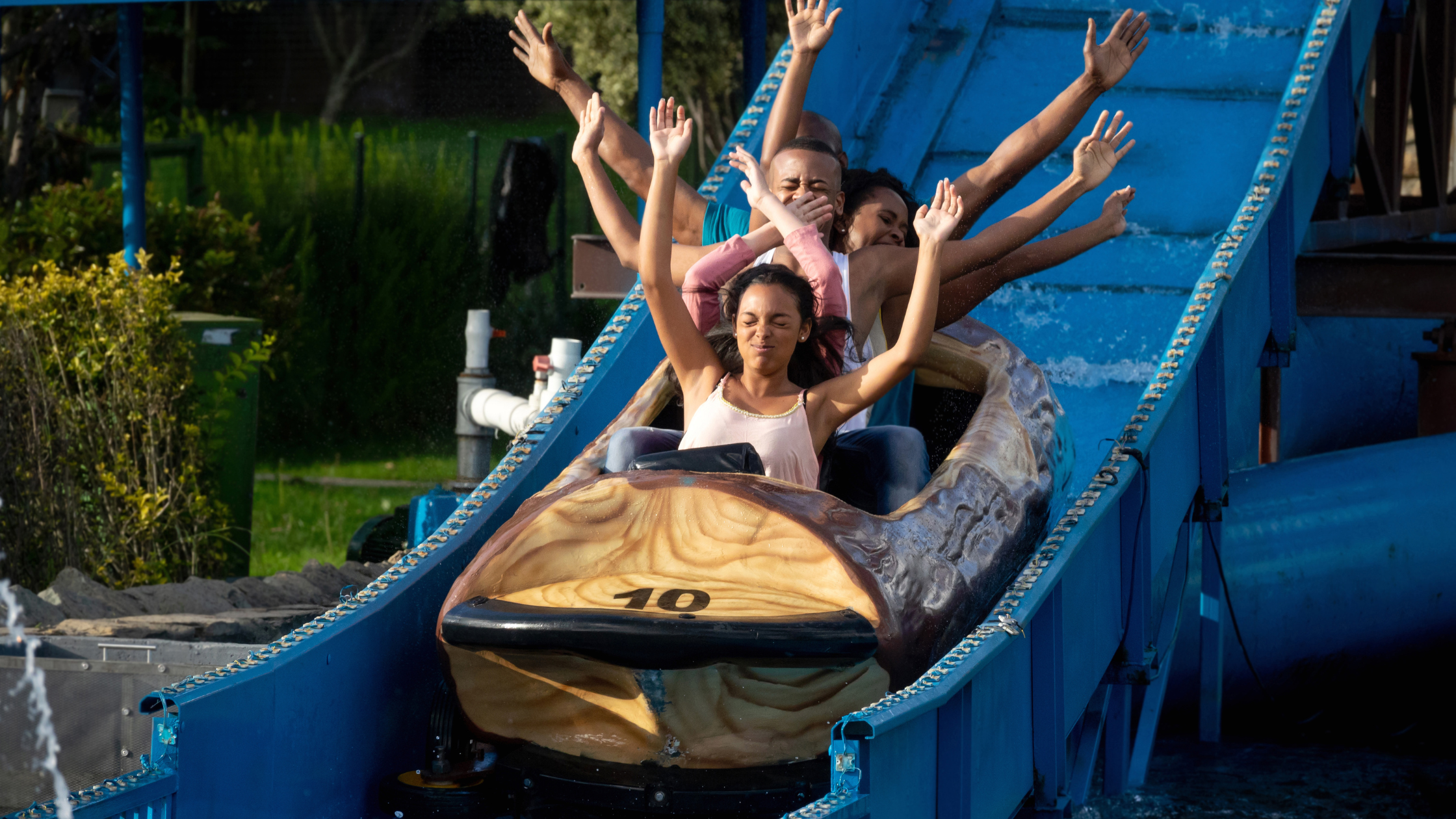 A family enjoying one of the thrilling amusement parks for kids.