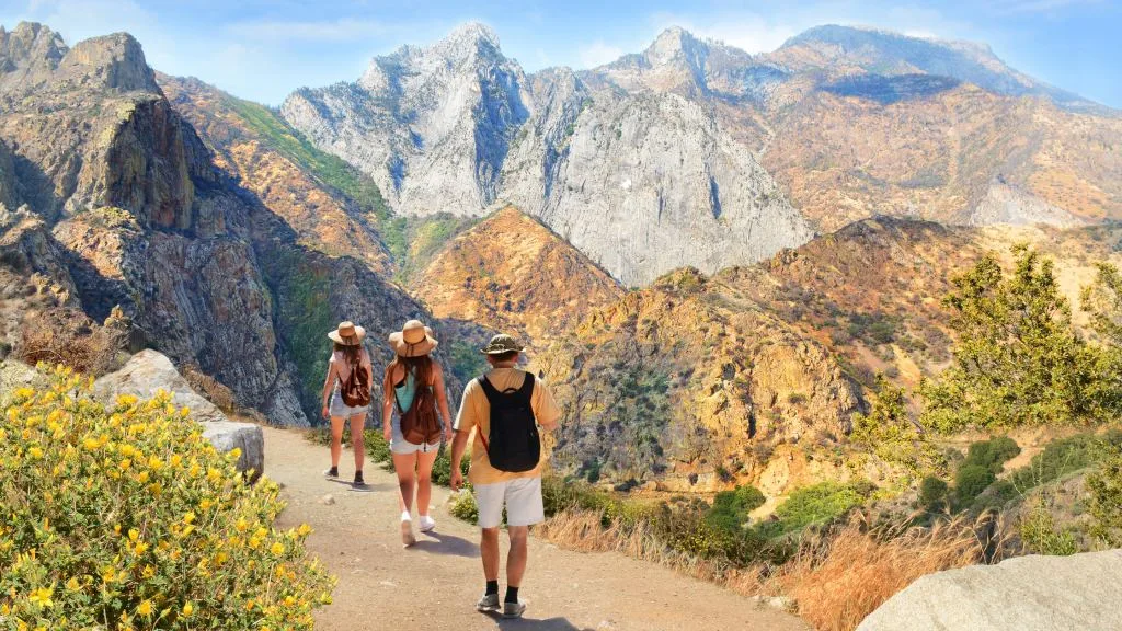 A family and their teenagers visiting one of many best vacation spots for teens. 