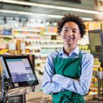 An image of a teenager as a cashier for an article about "how to start a business as a teen."