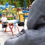 An image of children being watched by a stranger for an article about "safety activities for kids."