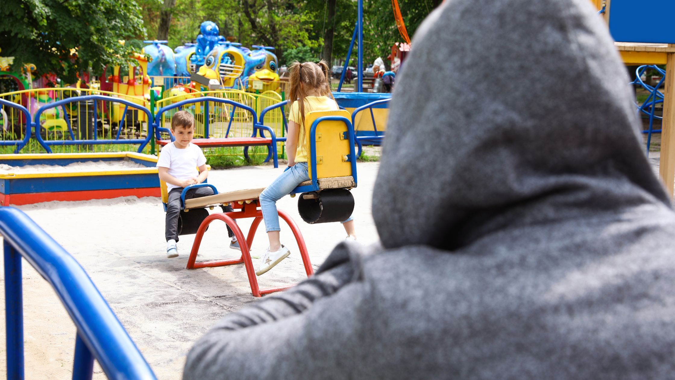 An image of children being watched by a stranger for an article about "safety activities for kids."