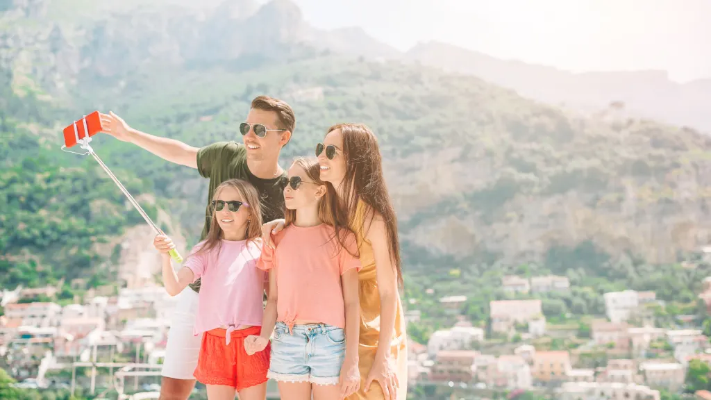 An image of a family taking a selfie picture during an educational European family vacation.