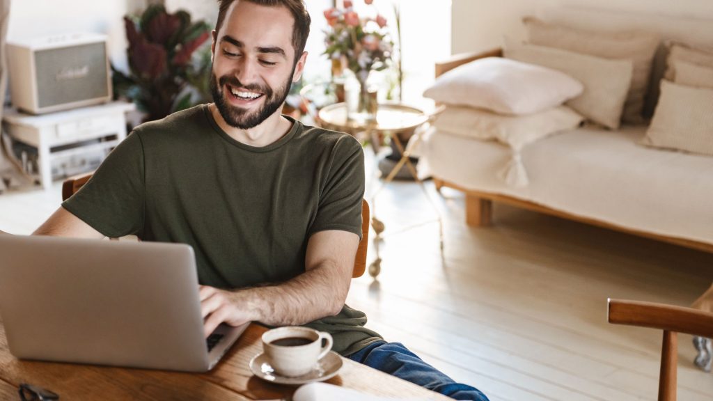 An image of a man working in his living room.