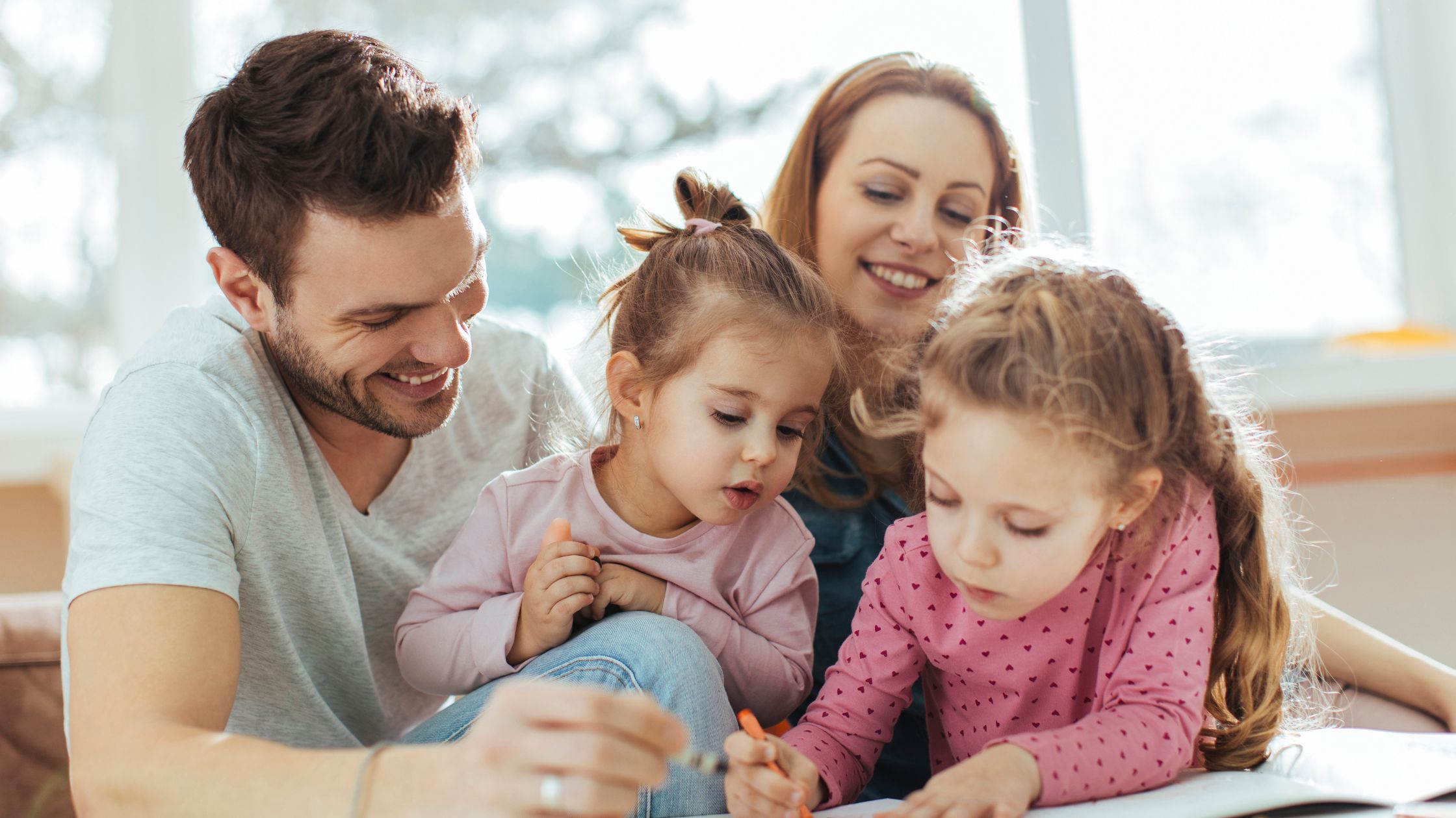 An image of parents interacting with their children for an article about "parenting philosophies."