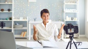An image of an Airbnb host doing a video advertisement for an article about Airbnb advertising strategy.