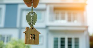 An image of an Airbnb house key for an article about Airbnb pricing strategies.