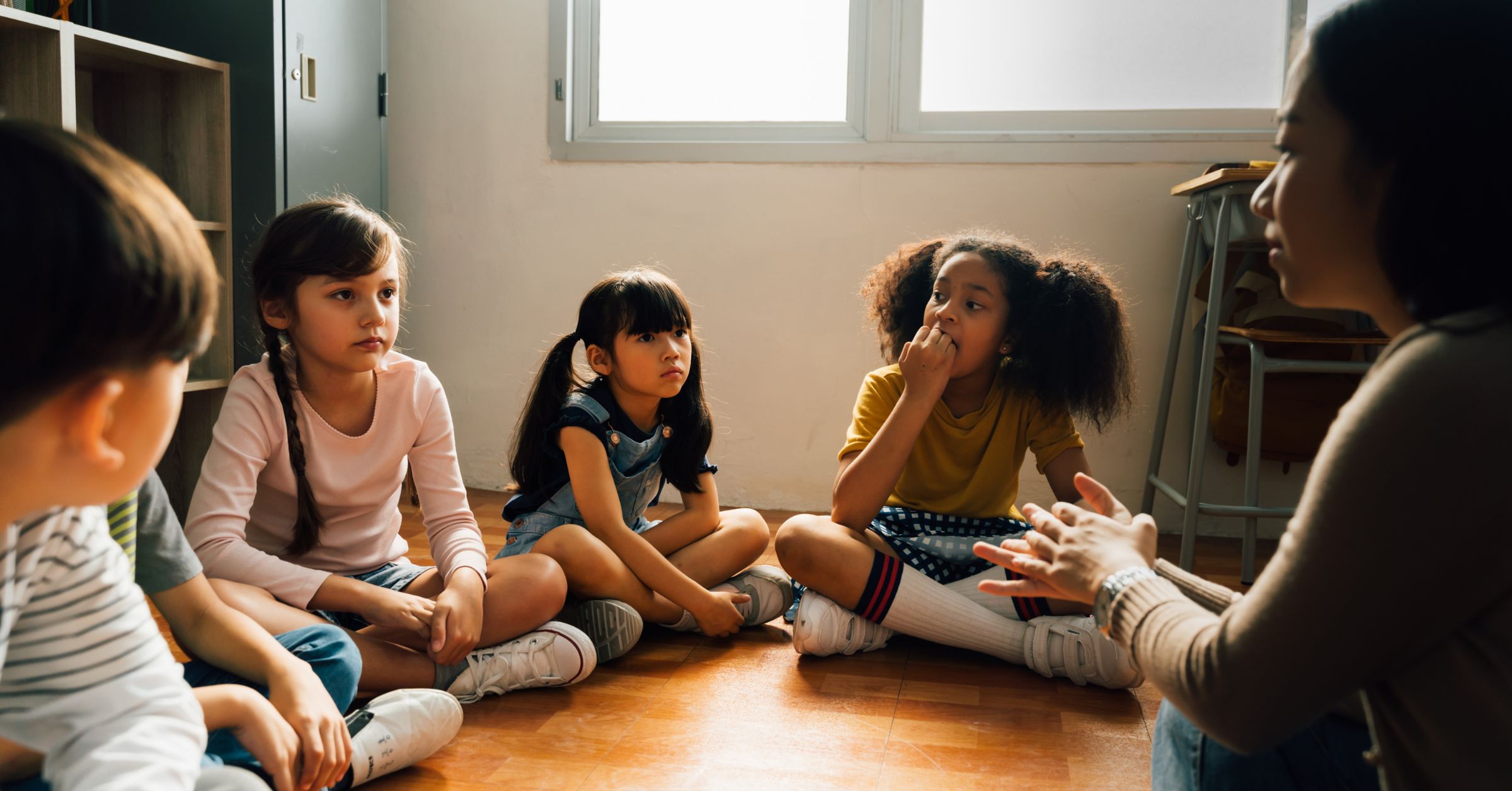 An image of children in a play room for an article about "diversity activities for kids."