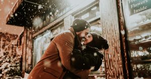 couple madly in love kissing in the snow