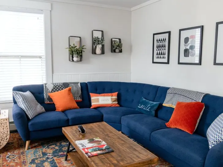 An image of a professionally decorated living room for an article about Airbnb decorating ideas.