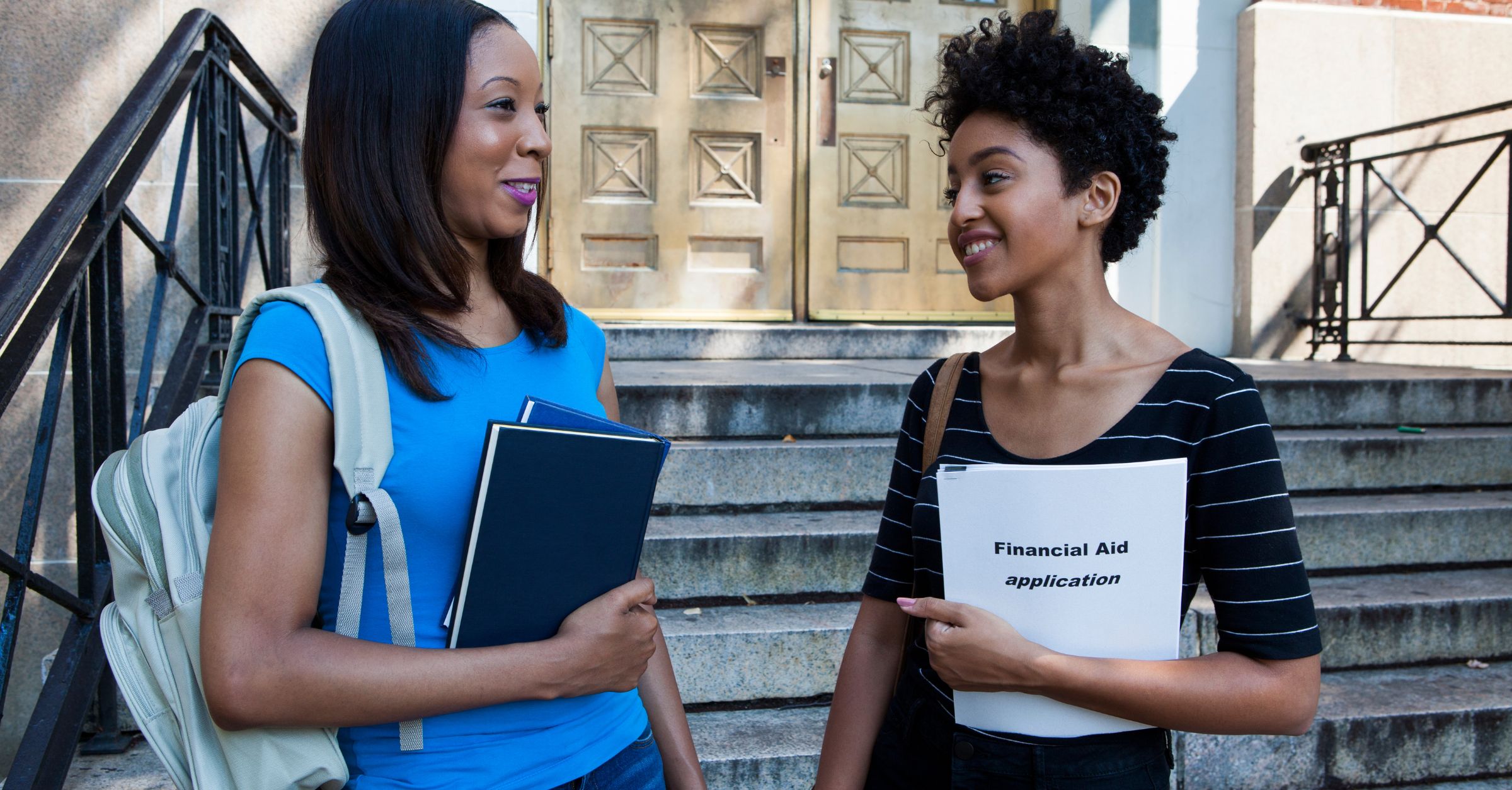An image of young adults holding financial books for an article about the best books on financial independence.