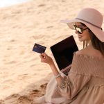 An image of a digital nomad checking her credit card statement for an article about travel hacks.