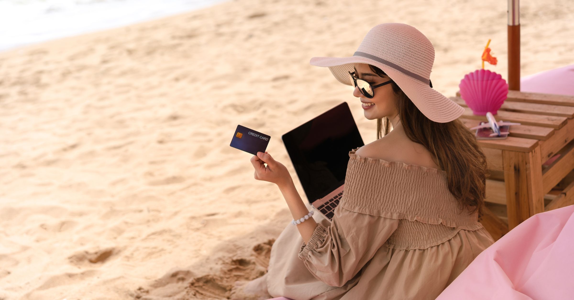 An image of a digital nomad checking her credit card statement for an article about travel hacks.