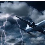 An image of a plane going through dark cloudes for an article about "can turbulence crash a plane"