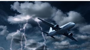 An image of a plane going through dark cloudes for an article about "can turbulence crash a plane"