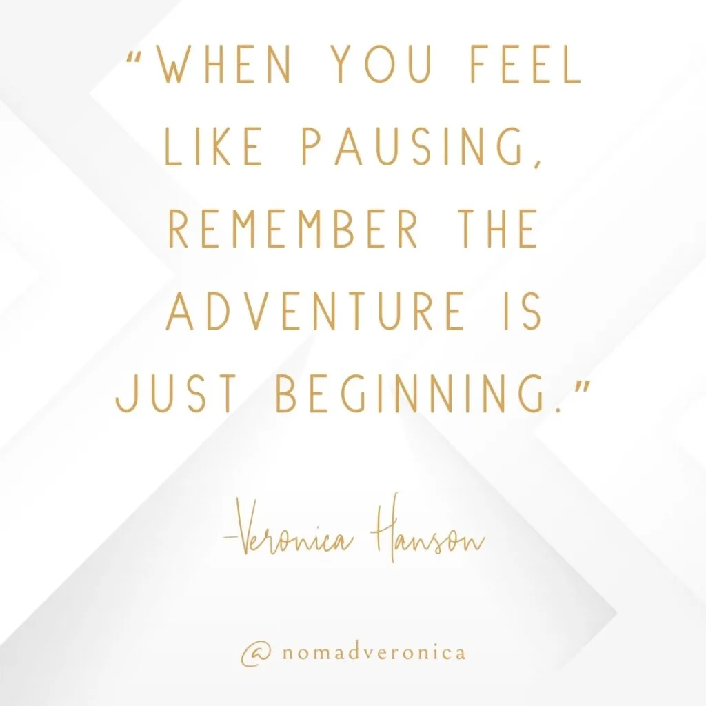 A motivational quote by Veronica Hanson reads, "When you feel like pausing, remember the adventure is just beginning," in refined gold text on a sleek white geometric backdrop. The image also features "@nomadveronica," aligning with themes of resilience and embracing life's ongoing journey.