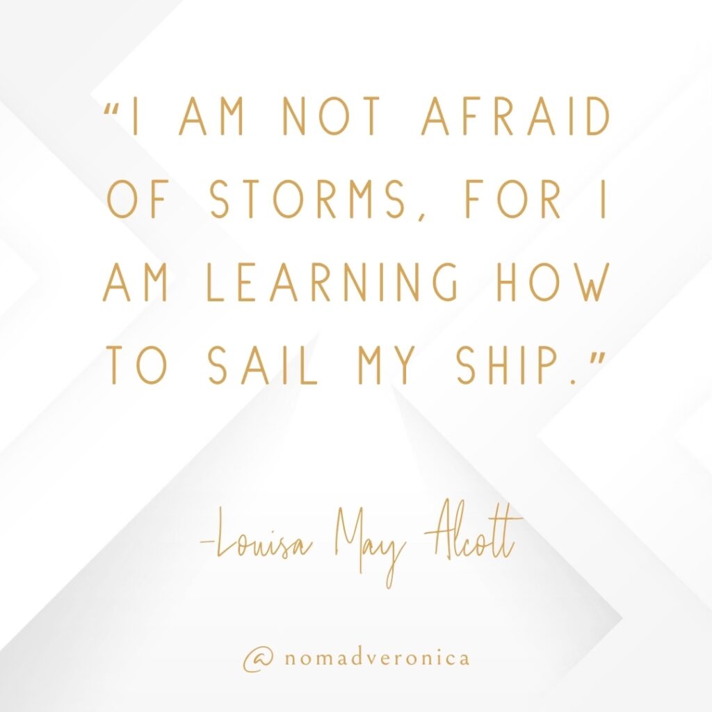 A motivational quote by Louisa May Alcott reads, "I am not afraid of storms, for I am learning how to sail my ship," in gold text on a crisp white geometric background. The design includes the handle "@nomadveronica," emphasizing resilience and personal growth.