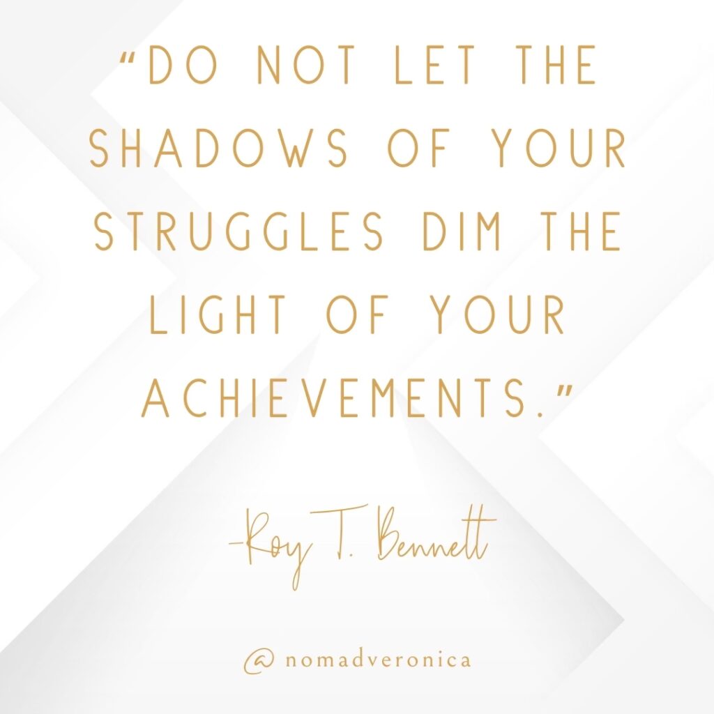 A motivational quote by Roy T. Bennett, "Do not let the shadows of your struggles dim the light of your achievements," is written in gold text on a white geometric background. The design is branded with the handle "@nomadveronica," giving a personal touch to this encouraging and uplifting message.