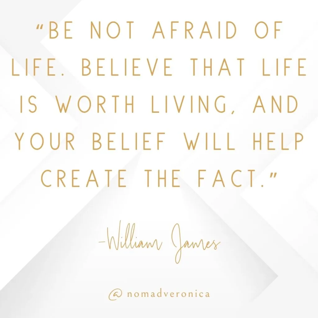 Minimalist white and gold graphic featuring the quote 'Be not afraid of life. Believe that life is worth living, and your belief will help create the fact' by William James, attributed to @nomadveronica. A perfect addition to a section on motivational quotes for embracing new challenges.