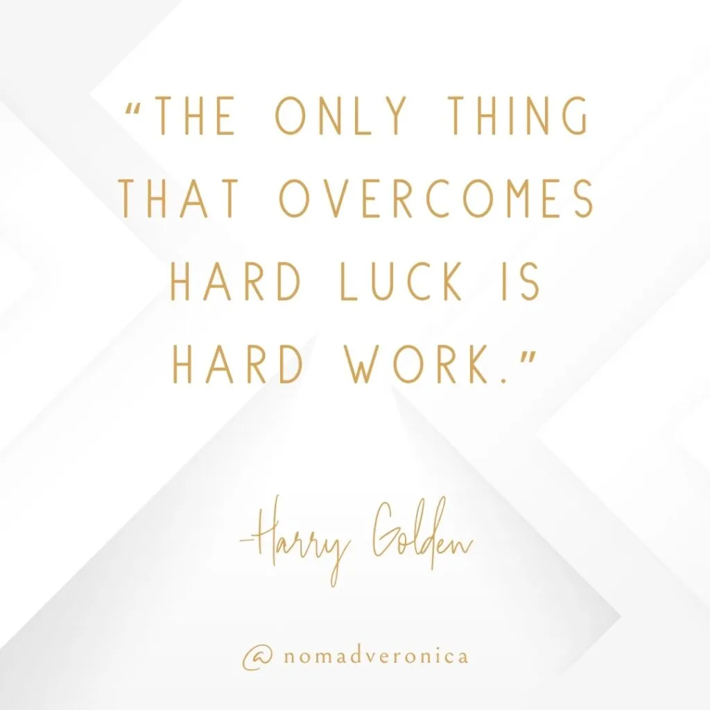 A quote by Harry Golden, "The only thing that overcomes hard luck is hard work," is elegantly displayed in gold font against a clean, white background with subtle geometric patterns. The minimalist design includes "@nomadveronica" at the bottom, reinforcing its inspirational and modern feel.