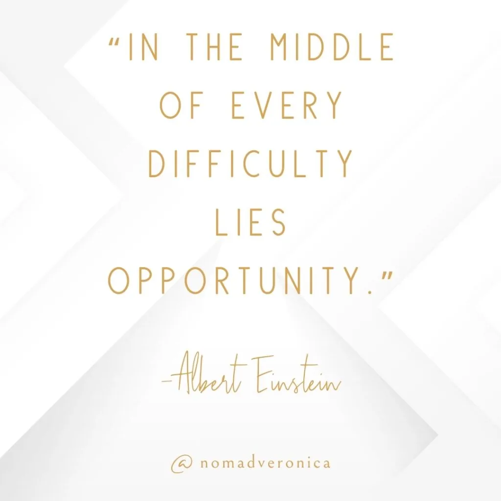 Minimalist graphic with a white and gold design featuring the quote 'In the middle of every difficulty lies opportunity' by Albert Einstein, attributed to @nomadveronica. Ideal for an article section on motivational quotes about overcoming challenges.