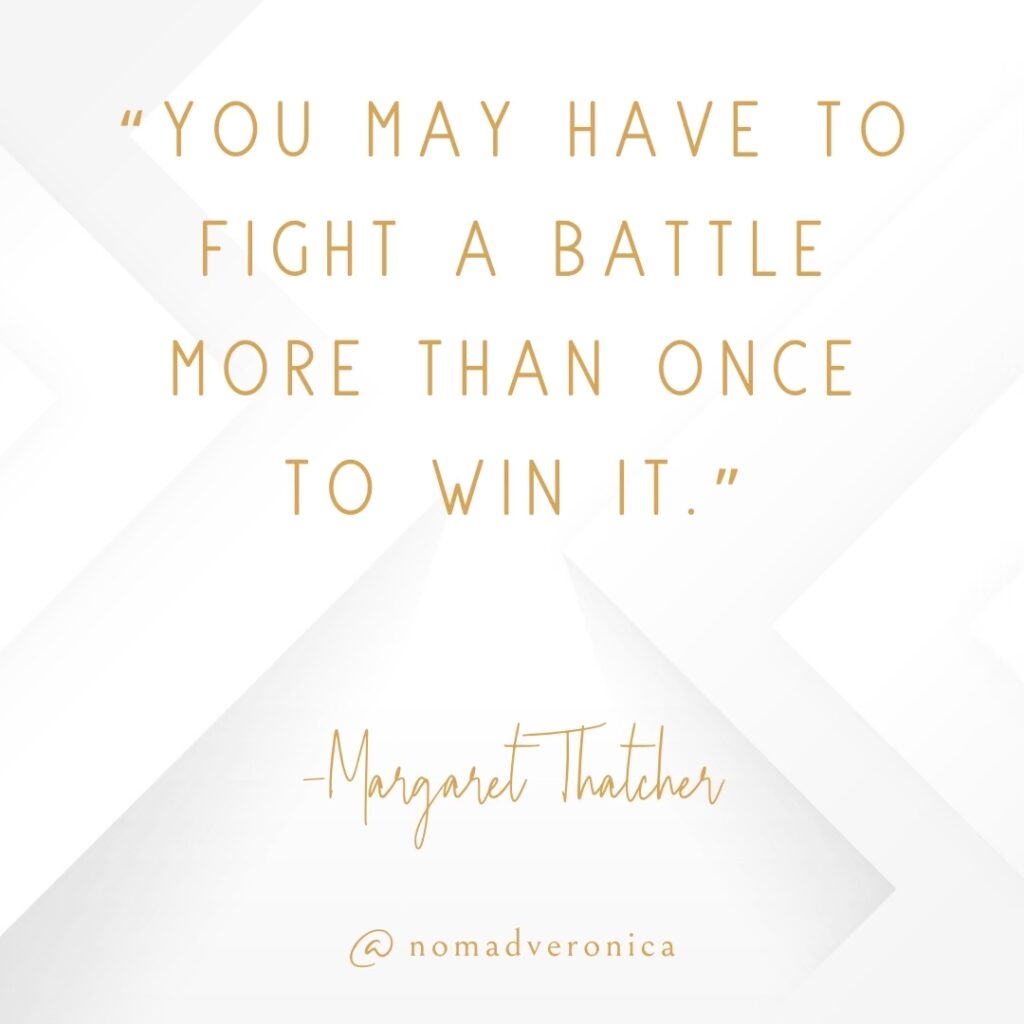 A motivational quote by Margaret Thatcher reads, "You may have to fight a battle more than once to win it," displayed in an elegant gold font over a white geometric background. The image is branded with "@nomadveronica," adding a personalized element to the inspiring design.