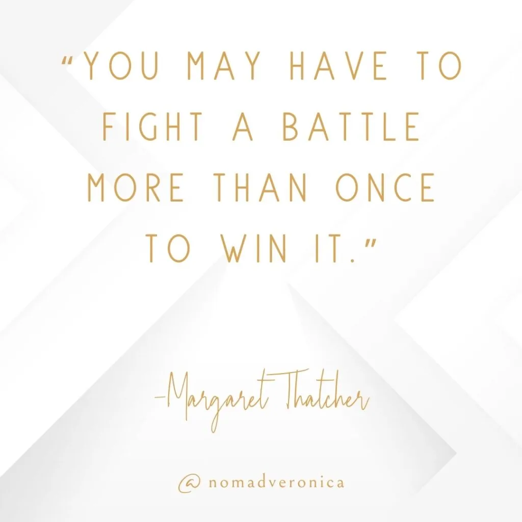 A motivational quote by Margaret Thatcher reads, "You may have to fight a battle more than once to win it," displayed in an elegant gold font over a white geometric background. The image is branded with "@nomadveronica," adding a personalized element to the inspiring design.