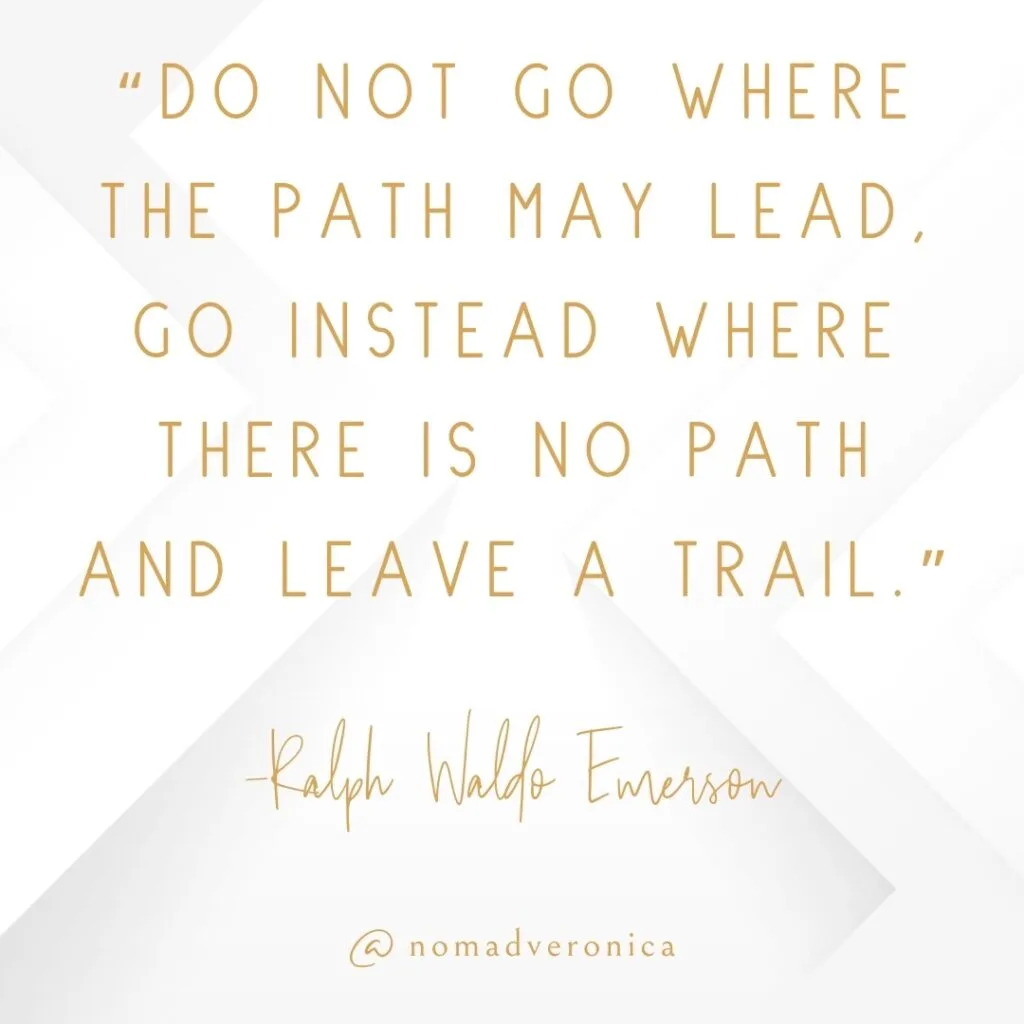White and gold minimalist graphic showcasing the quote 'Do not go where the path may lead, go instead where there is no path and leave a trail' by Ralph Waldo Emerson, attributed to @nomadveronica. Perfect for a section on motivational quotes about overcoming challenges.