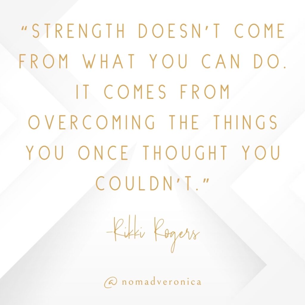 A minimalist white and gold graphic displaying the quote: "Strength doesn’t come from what you can do. It comes from overcoming the things you once thought you couldn’t." by Rikki Rogers. The elegant typography complements the inspirational tone, with "@nomadveronica" subtly included at the bottom for branding.