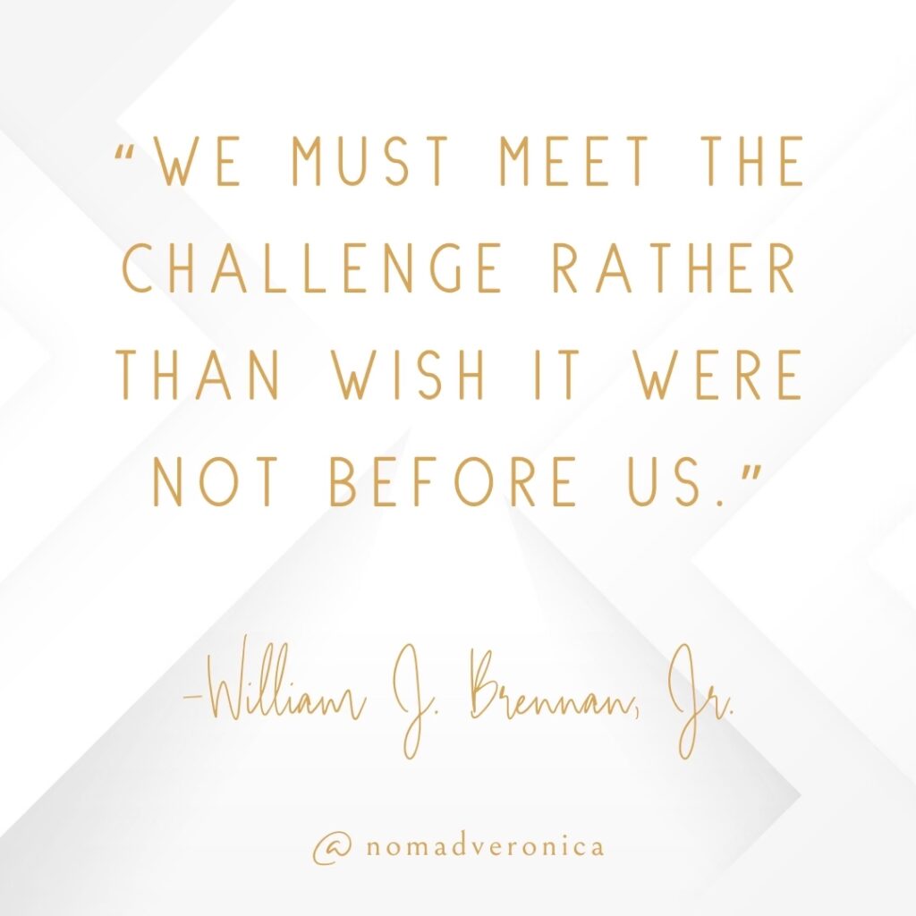 Minimalist white and gold graphic featuring the quote 'We must meet the challenge rather than wish it were not before us' by William J. Brennan, Jr., attributed to @nomadveronica. A fitting choice for a section on motivational quotes for embracing new challenges.