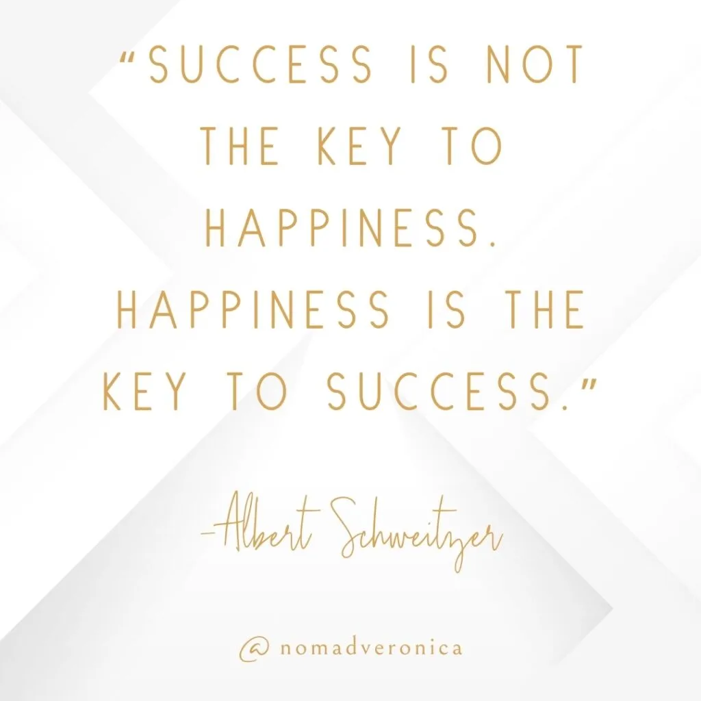 White and gold minimalist graphic featuring the quote 'Success is not the key to happiness. Happiness is the key to success' by Albert Schweitzer, attributed to @nomadveronica. An uplifting addition to a section on motivational quotes for navigating new challenges.