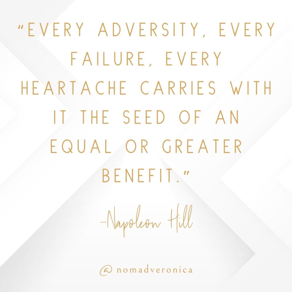 Minimalist white and gold graphic featuring the quote 'Every adversity, every failure, every heartache carries with it the seed of an equal or greater benefit' by Napoleon Hill, credited to @nomadveronica. Ideal for a section on motivational quotes about overcoming challenges.