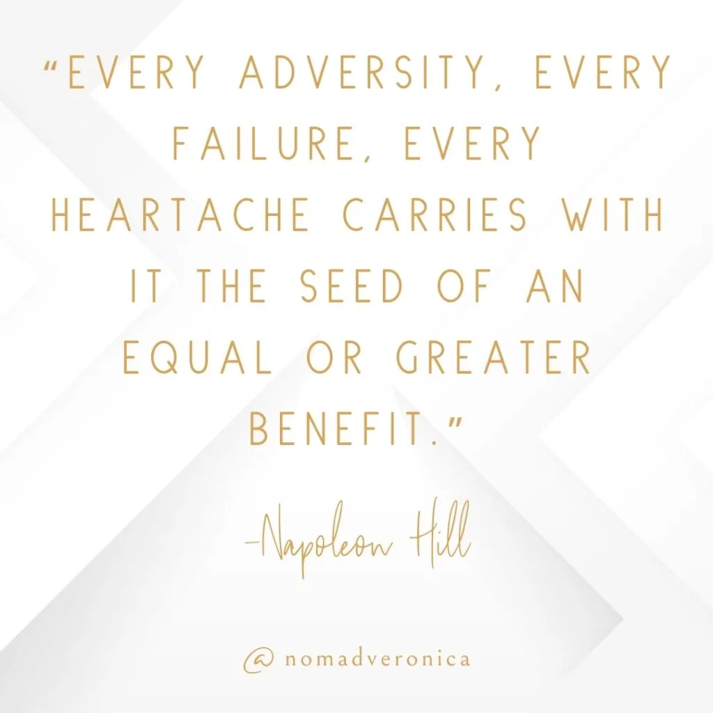 Minimalist white and gold graphic featuring the quote 'Every adversity, every failure, every heartache carries with it the seed of an equal or greater benefit' by Napoleon Hill, credited to @nomadveronica. Ideal for a section on motivational quotes about overcoming challenges.