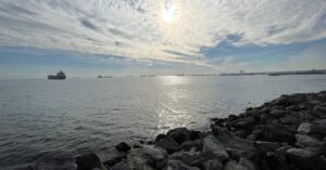 Serene view of the Marmara Sea with cargo ships in the distance under a cloudy sky, offering a glimpse of the peaceful waterfront locations to consider when deciding where to stay in Istanbul for families.