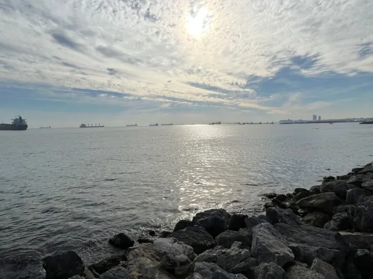 Serene view of the Marmara Sea with cargo ships in the distance under a cloudy sky, offering a glimpse of the peaceful waterfront locations to consider when deciding where to stay in Istanbul for families.