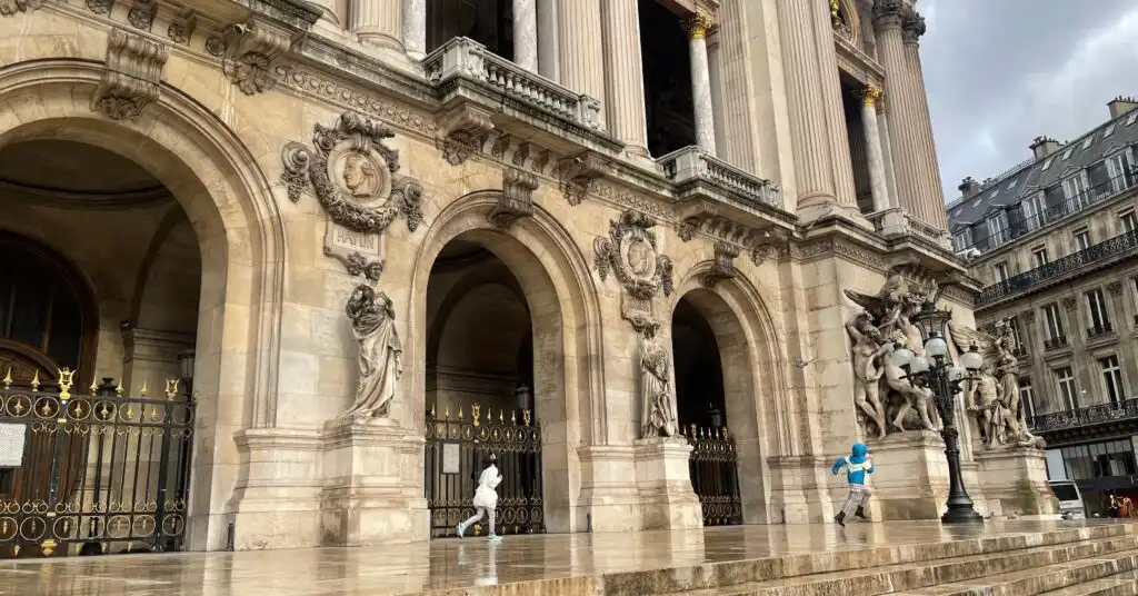 Children playing near the grand entrance of Palais Garnier in Paris, showing a glimpse of everyday life for American families in France