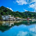 Colorful seaside homes and crystal-clear waters in Roatán, perfect for expat families looking for a laid-back lifestyle.