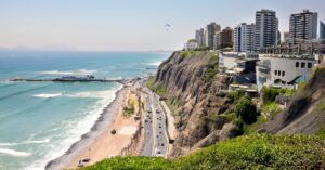 Coastal cityscape of Lima, a common destination for those moving to Peru seeking city life.