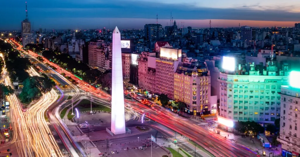 Long-exposure shot of traffic lights circling the iconic Obelisk in central Buenos Aires — a vibrant part of daily life for an American moving to Argentina’s capital.